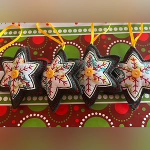 Set of four Matilda Jane star ornaments.